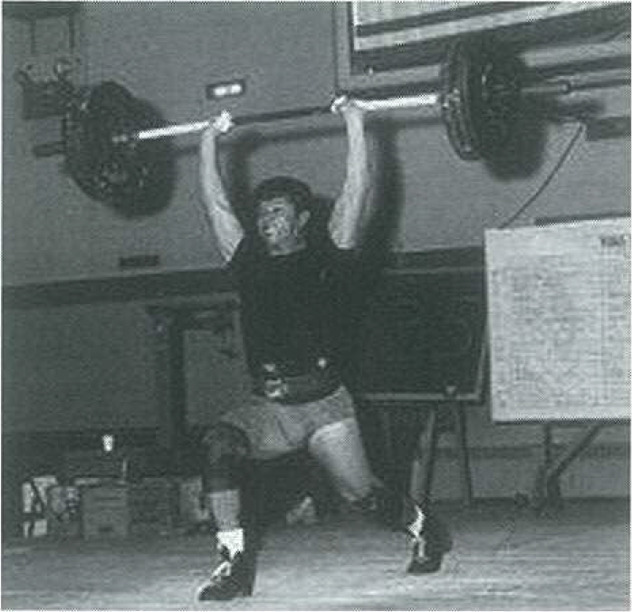 Jack King performing a clean and jerk